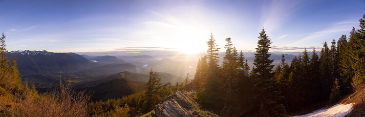 Panoramic View of Fraser Valley during a colorful cloudy sunset. Taken from Elk Mountain in Chilliwack, East of Vancouver, British Columbia, Canada. Nature Landscape Panorama Background © edb3_16