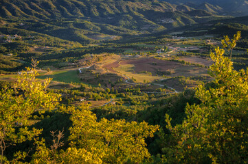 Autumnal sunrise seen from the Santuari dels Munts viewpoint in Lluçanès (Osona, Barcelona,...