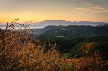 Autumnal sunrise seen from the Santuari dels Munts viewpoint in Lluçanès (Osona, Barcelona, Catalonia, Spain)
