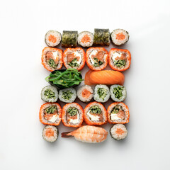 Mixed Sushi and Sashimi Set, rolls on white background. Traditional Japanese food. Healthy Oriental meal. Wellness concept. Flat lay. Top view. Copy space.