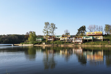 GRODEK NAD DUNAJCEM, POLAND - MAY 28, 2021: Cottages for tourists right on the lake Roznowskie