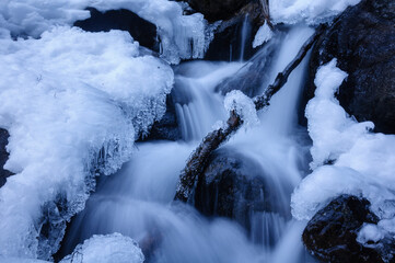 Detail of snow and ice in the Ratera waterfall during winter (Aigüestortes i Estany de Sant Maurici National Park, Catalonia, Spain, Pyrenees)