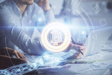 Double exposure of man and woman working together and crypto finance theme hologram. Blockchain business concept. Computer background.