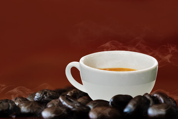 Hot coffee in a white coffee cup and many coffee beans placed around on wooden table on light brown background.