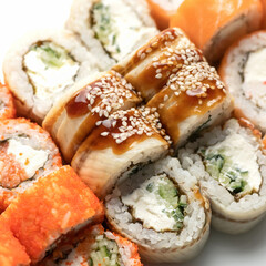 Close up of Inside-out mixed Sushi Set. Traditional Japanese Sushi rolls. Healthy Oriental food. Wellness concept. Close up shot. Top view. Soft focus.