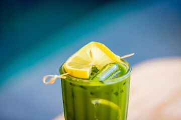 Green tea with lemon on wooden table background with copy space