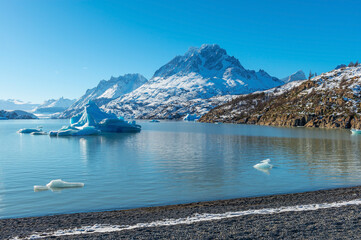 Lago Grey (Grey Lake) in winter with iceberg and Grey glacier in background, Torres del Paine national park, Patagonia, Chile.