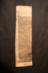 Manuscript fragment from a leaf written in medieval times on vellum or parchment. These fragments and leaves are taken from the bindings of books and were used as waste pieces. 