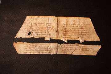 Manuscript fragment from a leaf written in medieval times on vellum or parchment. These fragments...