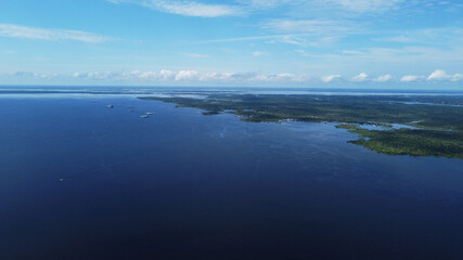 Aerial view of Negro river and Amazon rainforest, near the city of Manaus, Amazonas state, Brazil.