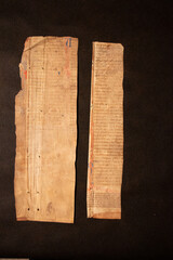 Medieval manuscript fragments written about the thirteenth century C13th on vellum or parchment, animal skins, by monks or scribes usually in a monastery. The leaves were used later as bookbinding.