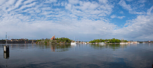 Morning view over the harbor islands of Stockholm with boats and old castle