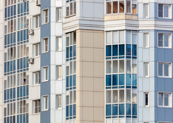 Fototapeta na wymiar Windows in a multi-storey building