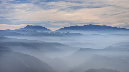 Fototapeta na wymiar Winter morning mist on the Tavertet cliffs (Barcelona province, Catalonia, Spain)