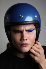 Attractive motor biker in blue helmet mockup set. Vertical headshot.