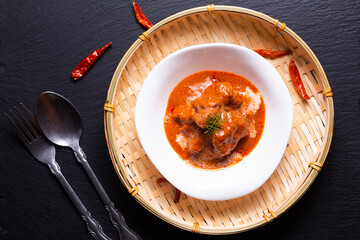 Thai cusine concept homemade Red curry veal Panang in black bachgroung with copy space
