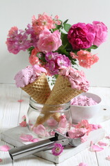 Still life with fruit ice cream and a bouquet of roses on a white background