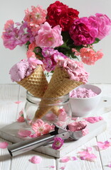 Still life with fruit ice cream and a bouquet of roses on a white background