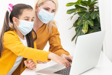 Online remote learning. School kids with computer having video conference chat with teacher and class group. Child studying from home. Homeschooling during quarantine and coronavirus outbreak