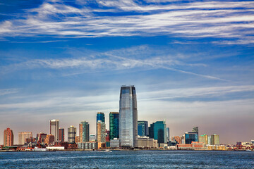 Obraz premium Colgate Center Rising from the Hudson Riverfront in Jersey City