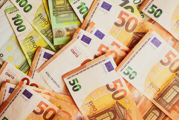 Euro Money Banknotes background texture. Fifty and one hundred banknotes only.