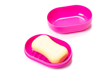 Travel soap in plastic soap dish isolated on white background