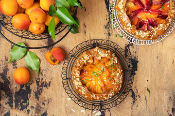 Apricot and plum galette, pie, cake with almond. Summer food.