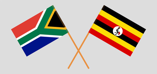 Crossed flags of Republic of South Africa and Uganda. Official colors. Correct proportion