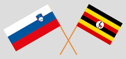 Crossed flags of Slovenia and Uganda. Official colors. Correct proportion