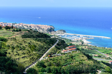 Fototapeta premium An areal view of picturesque holiday town of Tropea on a clear blue-sky day during late summer 
