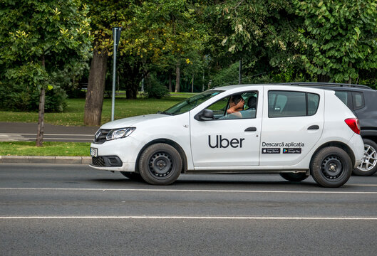 Bucharest/Romania - 07.15.2020: Car With The Logo Of The Ride Hailing Company Uber In Traffic.