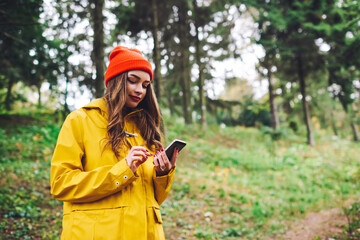 Serious woman browsing smartphone finding route
