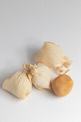 Typical Brazilian sweet known as dulce de leche in a straws (doce de leite na palha) isolated on white background.