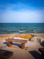 Seascape with stone memorial benches. Memories of loved ones.