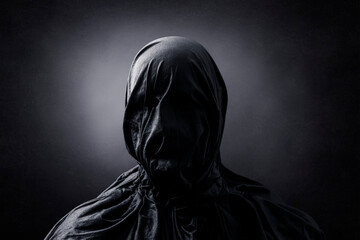 Fototapeta na wymiar Creepy figure over dark misty background