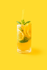 yellow cocktail with popcorn on color background 