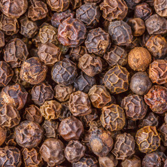 Large pile of allspice peas. Food background.Background made of middle eastern traditional spice . Top view.Textures of colorful spices and condiments.