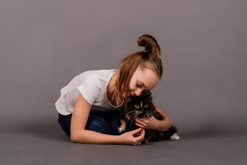 Fototapeta na wymiar I love my kitten, little girl holding her new pet