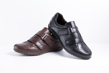 Male black and brown leather shoes on white background, isolated product.
