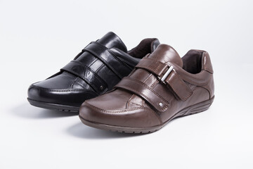 Male black and brown leather shoes on white background, isolated product.