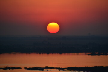 Obraz premium sunset over the river