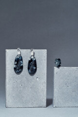 Handmade set of a ring and dangle teardrop earrings made of dark blue epoxy resin with silver foil...