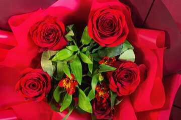 Red roses in a bouquet from top view