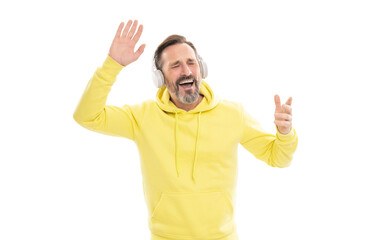 Fototapeta premium cheerful mature man in hoody listen music or audio book in headphones isolated on white, singer.