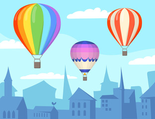 Obraz premium Air balloons over city cartoon illustration. Three bright colorful aerostats floating over silhouetted city or town. Clear blue sky with white clouds. Aeronautics concept for website or landing page