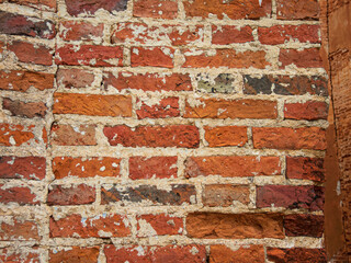 Photo texture witn ancient damaged red brick masonry