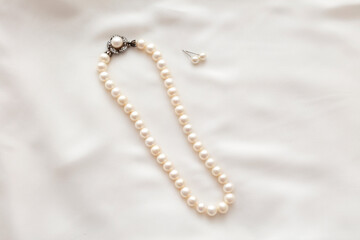 A pearl necklace against white background