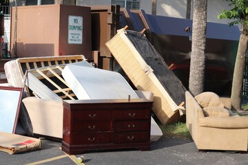 No Dumping Sign Above Discarded Furniture