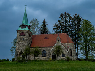 Fototapeta na wymiar Church Of The Divine Heart Of The Lord in Borovnicka, Podkrkonosi region in Czech republic after dark