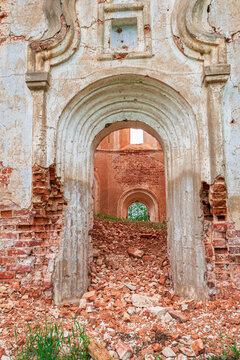 The second entrance to the old abandoned church. A lot of broken bricks on the ground. View from outside Russia, Smolensk region, 1753.